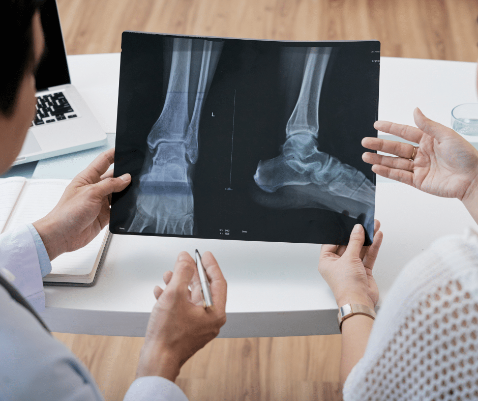 Doctor and patient looking at a foot x-ray