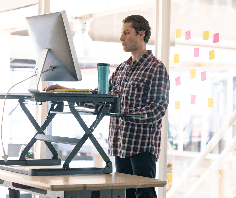 man at standing desk