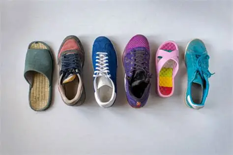 Several different kinds of shoes lined up in a row on a white floor